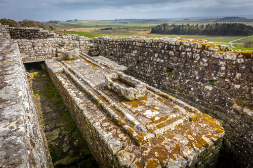 The communal Latrine at Housesteads Roman Fort. The drainage system still operates effectively today when it rains.